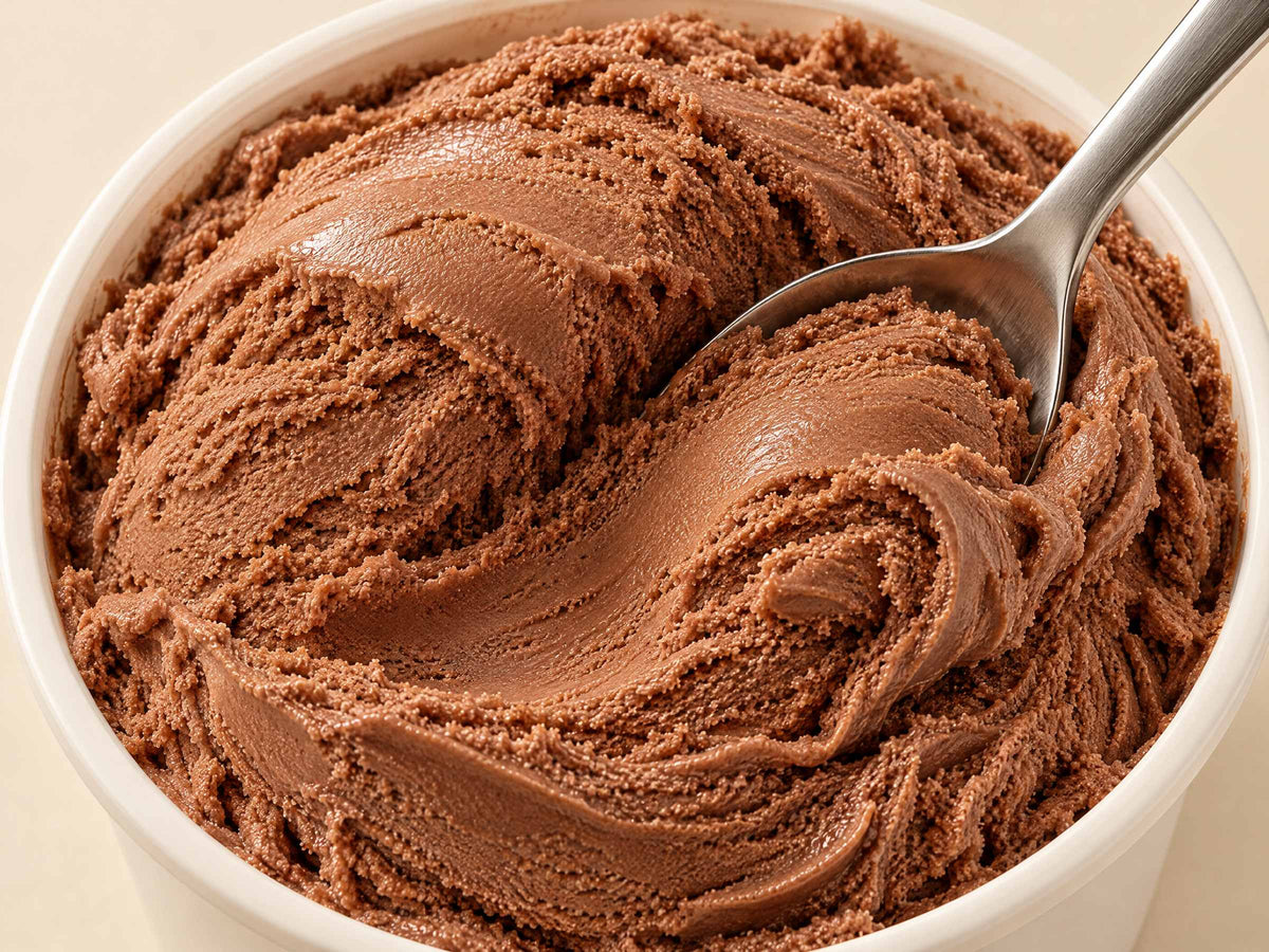 Close-up of Choc Heaven gelato in a tub with a spoon